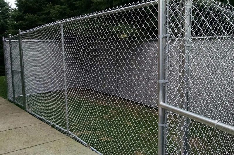 How can I maintain my chain link fence?